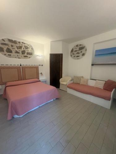 a bedroom with two beds in a room at Domo Acabara in Alghero