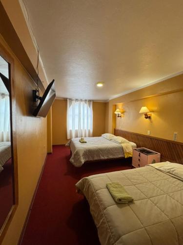 Llit o llits en una habitació de Hotel la casona