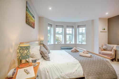 a bedroom with a large bed in a room at 2 Bed in Benllech oc-t34071 in Benllech