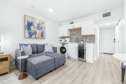 a living room with a couch and a kitchen at Golf Coast Bleu Studio - 3160 in Zephyrhills