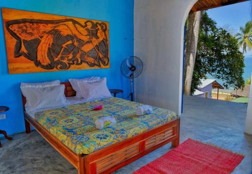 Llit o llits en una habitació de Villa Lokobe