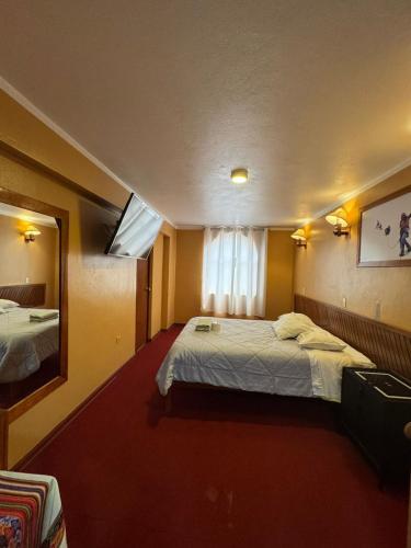 Llit o llits en una habitació de Hotel la casona