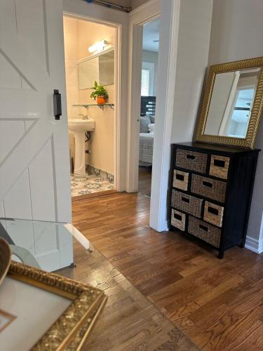 a room with a mirror and a dresser and a bathroom at Three Queens Entire House 3 Beds in Amarillo