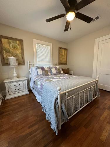 a bedroom with a bed and a ceiling fan at Three Queens Entire House 3 Beds in Amarillo