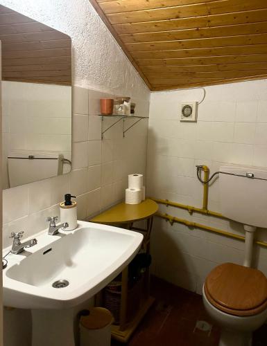 a bathroom with a sink and a toilet at A cozy cottage in Tomar in Tomar