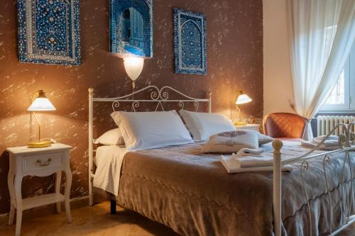Llit o llits en una habitació de Aedes B&B Il Giardino dei Sogni