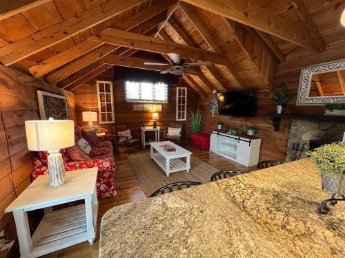 a living room with a couch and a table at Bavarian Brook Condo 12 in Helen