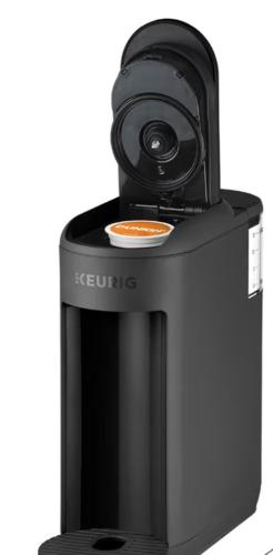 a coffee machine with a cup on top of it at Pocono cabin with hot tub and private pool at Shawnee Mtn in East Stroudsburg