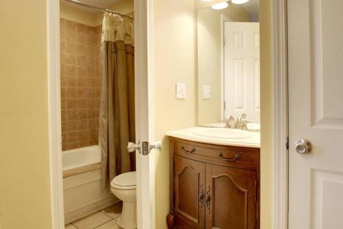 a bathroom with a sink and a toilet and a shower at Bavarian Brook Condo 10 in Helen