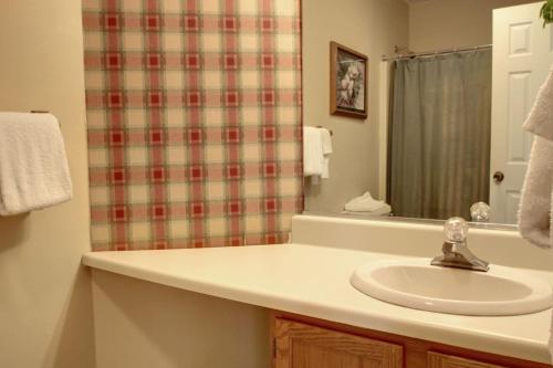 a bathroom with a sink and a shower at Rivers Edge 802b in Helen