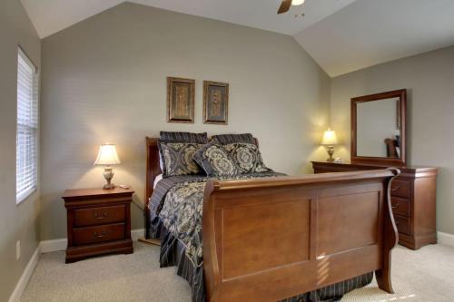 a bedroom with a large wooden bed with two night stands at Bavarian Brook Condo 16 in Helen