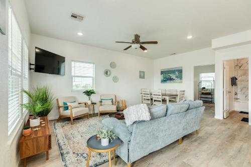 a living room with a blue couch and a table at Minutes to the Sand Spacious beautiful relaxing in Surfside Beach
