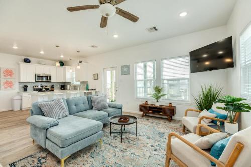 a living room with a blue couch and a table at Minutes to the Sand Spacious beautiful relaxing in Surfside Beach