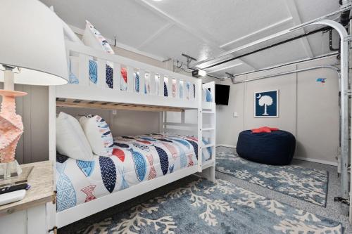 a bedroom with a bunk bed in a trailer at Channel Surfer in Myrtle Beach