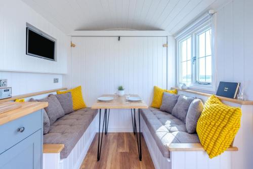 a living room with a couch and a table at 1 Bed in Saltfleetby oc-b30072 in Saltfleetby Saint Peter
