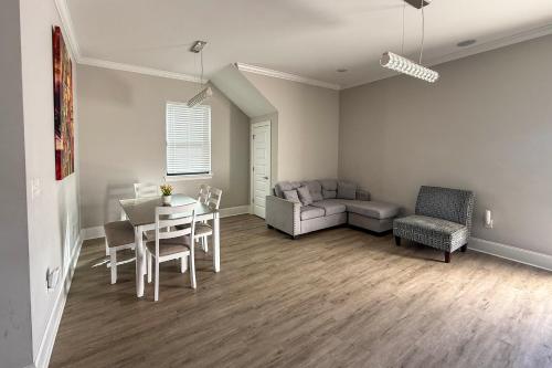 a living room with a table and chairs and a couch at 2 Mi to Dtwn Jazz Clubs and Soul Food! NOLA Home in New Orleans