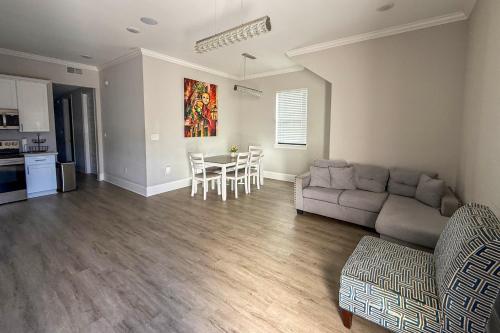 a living room with a couch and a table at 2 Mi to Dtwn Jazz Clubs and Soul Food! NOLA Home in New Orleans