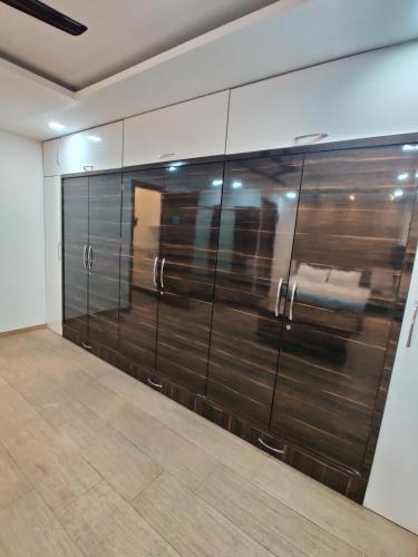 a large room with a large wall of metal doors at Sunleaf Palace in Pune