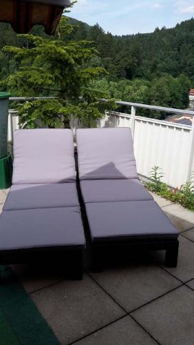 two beds sitting on top of a patio at Ferien Penthouse Panoramablick oder Studio Panoramablick in Bad Grund