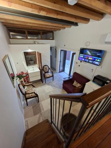 a view of a living room with a couch and chair at Cecilia Traditional House-Suites in Kalopanayiotis