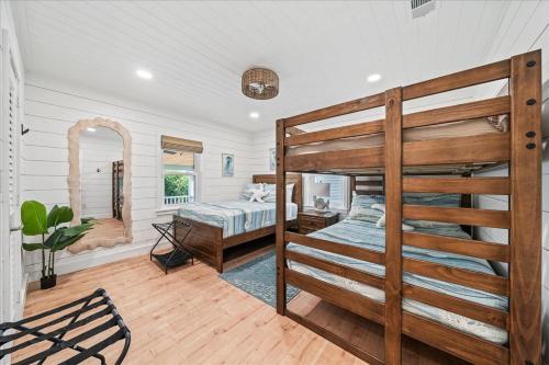 a bedroom with a bunk bed in a room at Private Pool, Backyard, and Steps to the Beach in Cocoa Beach