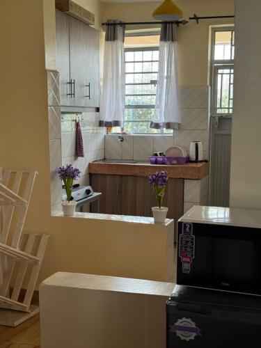 a kitchen with a sink and a counter top at TMT Homes in Nairobi