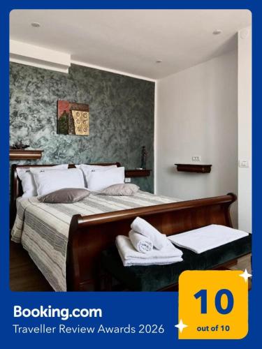 a bedroom with two beds with towels on them at Marsali Vila in Constanţa