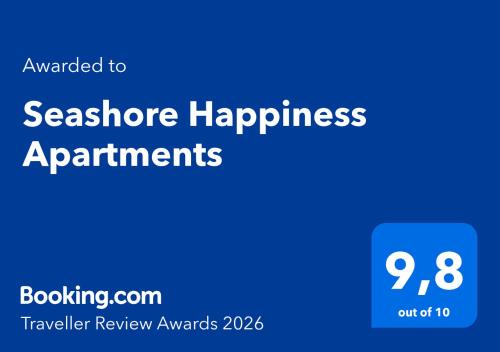 a blue sign that says seashore happiness apartments at Seashore Happiness Apartments in Porto Rafti