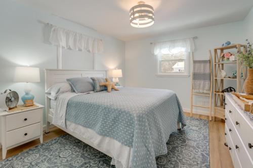 a bedroom with a bed with a teddy bear on it at Deck, Fire Pit! Fully Updated Home Near Lake Huron in Caseville