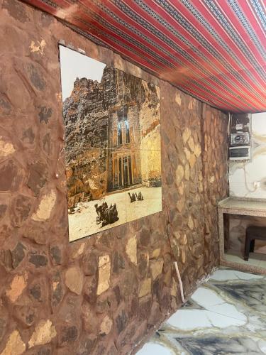a picture of the ruins of a church on a stone wall at Naif Bedouin tour in Wadi Rum