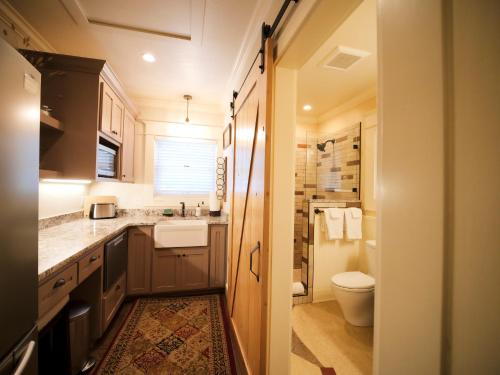 a small bathroom with a toilet and a sink at RedTail Inn - 3 Suites Sleeps up to 12 in Ashland
