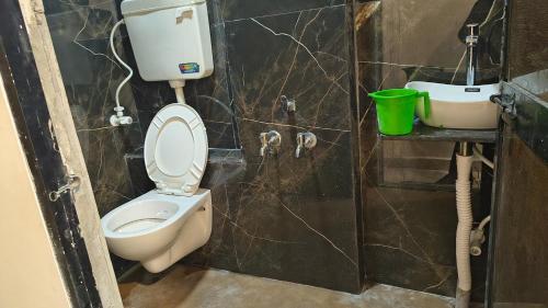 a bathroom with a toilet and a sink at Hotel flexistays central dhantoli in Dhantoli