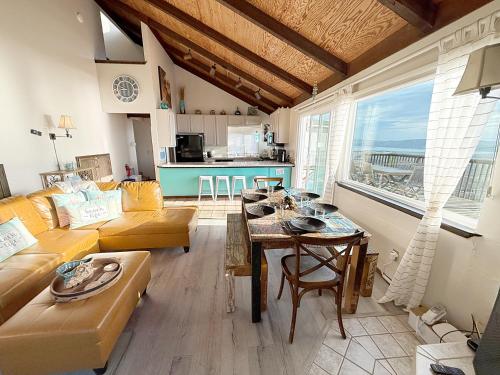 a living room with a couch and a table at Bella Oceana in Dillon Beach