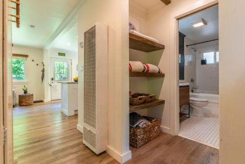 a bathroom with a toilet and a sink at Russian River Bungalow in Guerneville