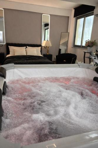 a bedroom with a bed with a rug on it at V&G palma di montechiaro in Palma di Montechiaro