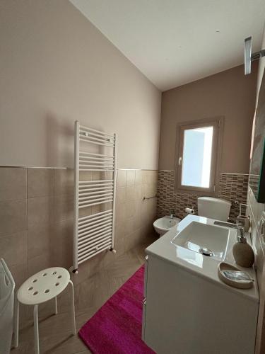 a bathroom with a sink and a toilet at Aidone Sunset House in Aidone