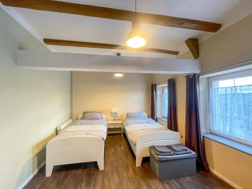 a hospital room with two beds and a window at Ferienhaus Sonnentälchen Weinberg in Konz