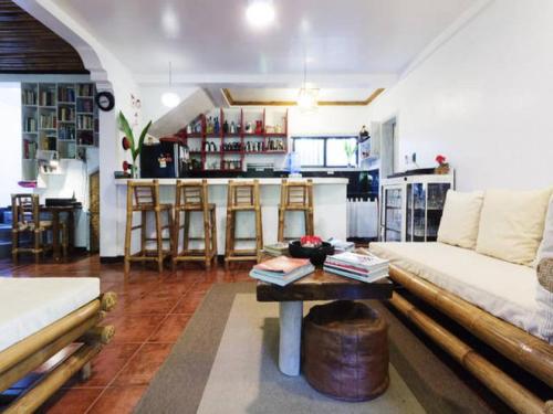 a living room with a couch and a table at Lanterna Hotel Boracay in Boracay