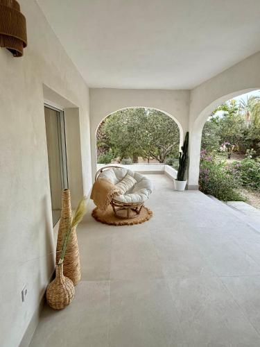 a living room with a couch on a patio at Villa Paz in El Campello