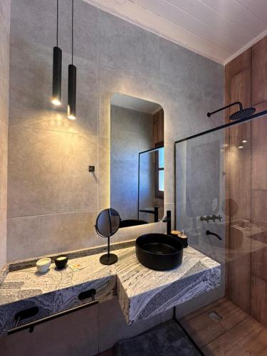 a bathroom with a sink and a mirror at El Refugio Lodge in Corrientes