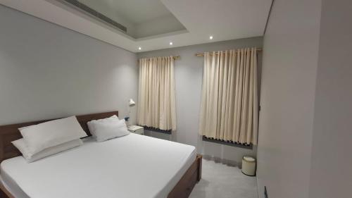 Tempat tidur dalam kamar di Eid Holiday