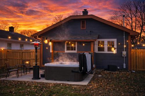 a hot tub in the backyard of a house at Indianapolis Broad Ripple Home with Hot Tub Near Downtown in Indianapolis
