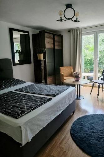 a bedroom with a large bed and a living room at Apartments with parking space Vodice - 927 in Vodice