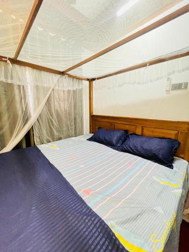 a bed in the middle of a tent at Madu Villa in Weligama