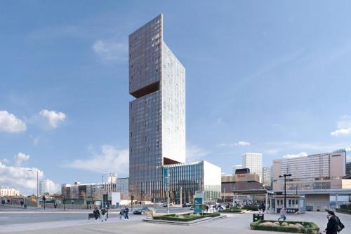 a rendering of a tall building in a city at Modern Stratford Westfield Olympic Village 1 Bedroom Apartment in London