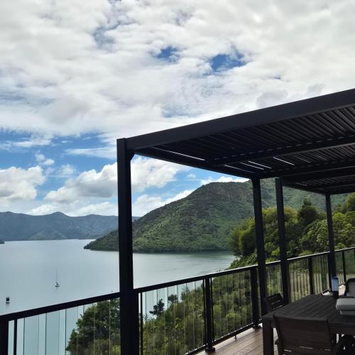 a view of a lake from the balcony of a house at Bayheights in Picton