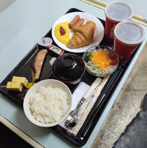 a tray of food with rice and eggs on a table at PrincessPrincessAzumino in Azumino