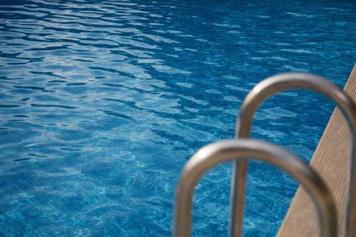 a close up of a pool of blue water at Bujtina Maria in Gjirokastër