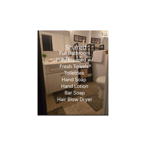 a picture of a bathroom with a sink and a toilet at Private Entrance OFFICE SPACE King Suite in Mission City