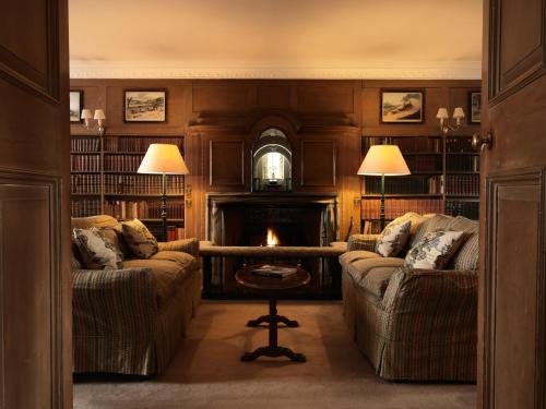 a living room with two couches and a fireplace at Greywalls Hotel & Chez Roux in Gullane